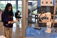 Student working with robot